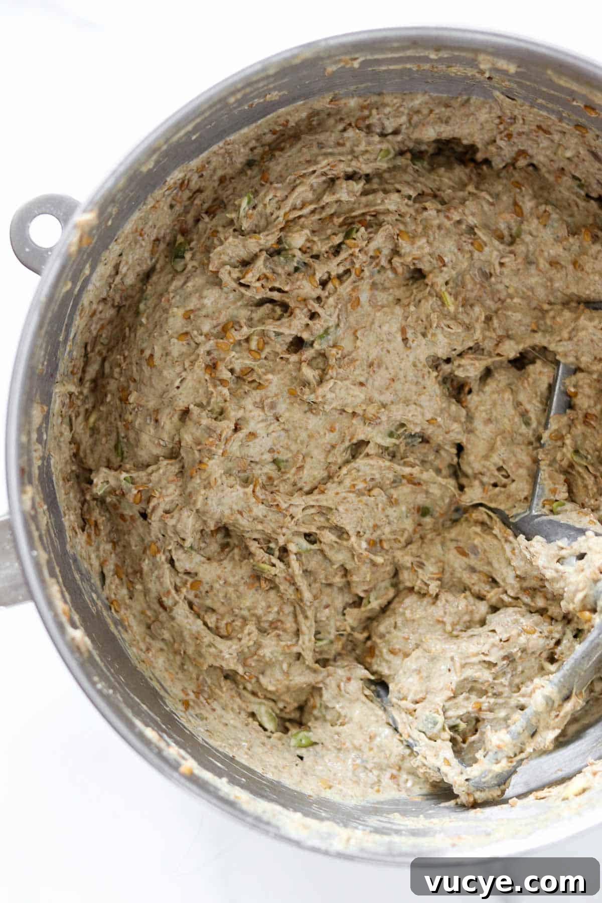 Danish rye bread dough in a metal bowl.