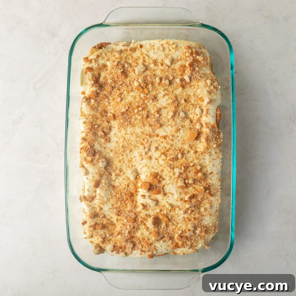 layer of bananas topped with a layer of pudding and crushed vanilla wafers. 