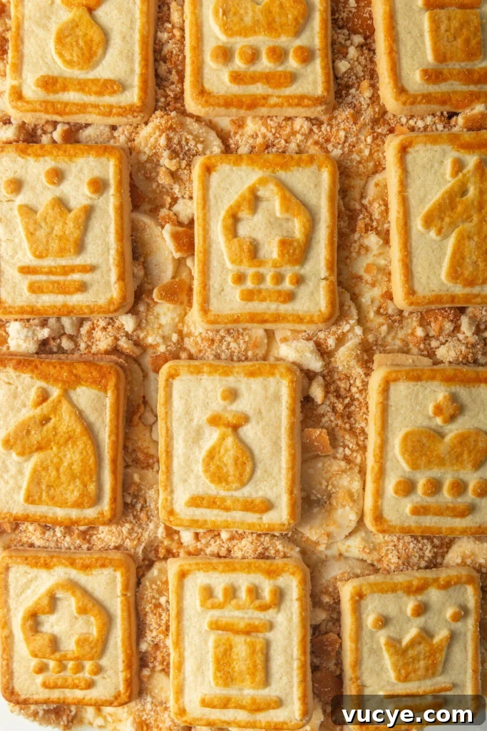 close up of Chessmen cookies on top of Southern Banana Pudding.