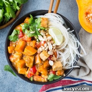 Thai Squash Tofu Curry in a plate with noodles.