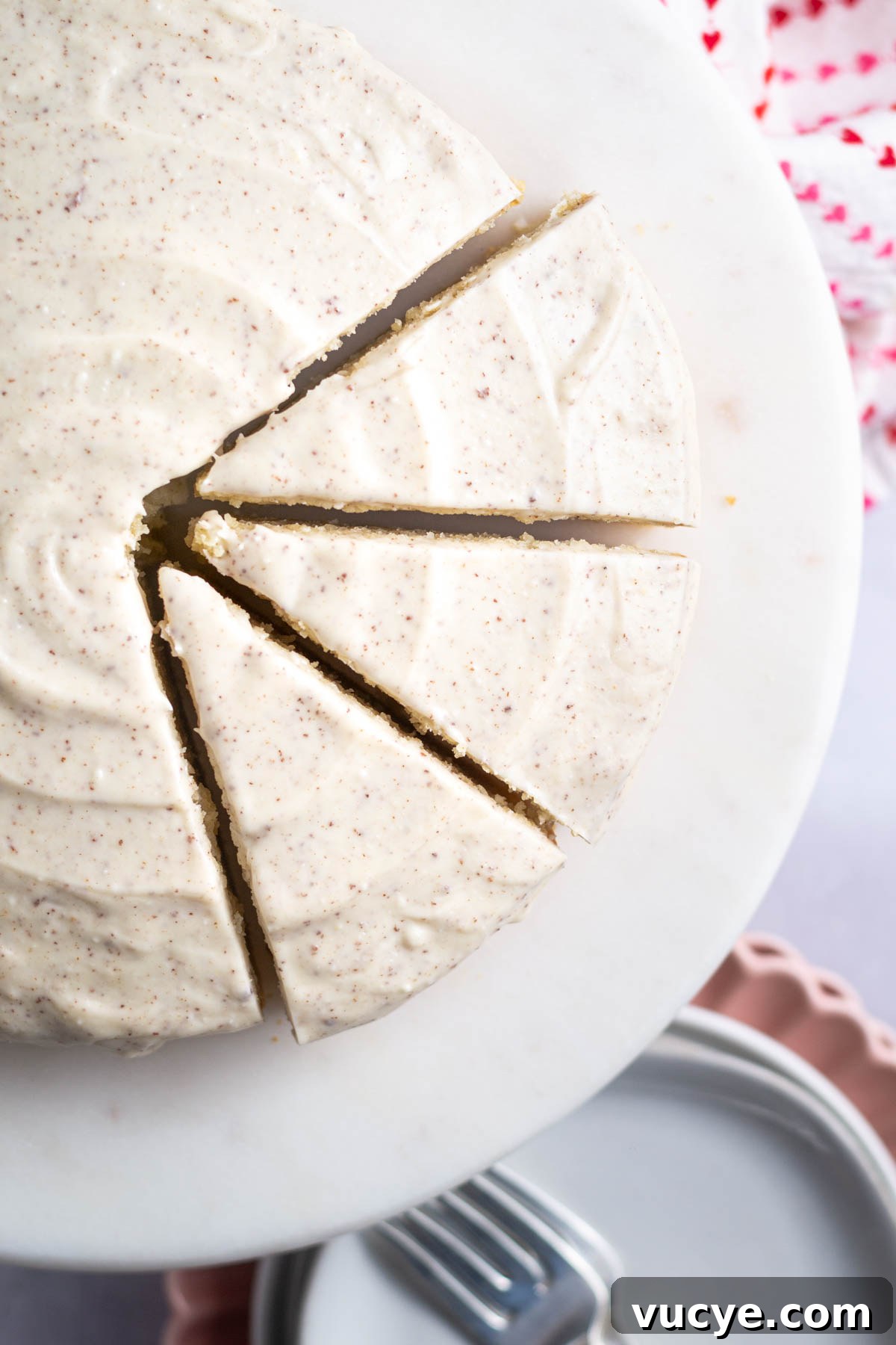 Moist Cardamom Cake Recipe with Warm Spices 11 slices of cake on a cake stand