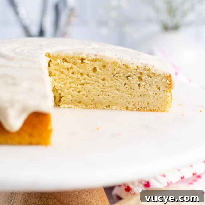 sliced cardamom cake on cake stand