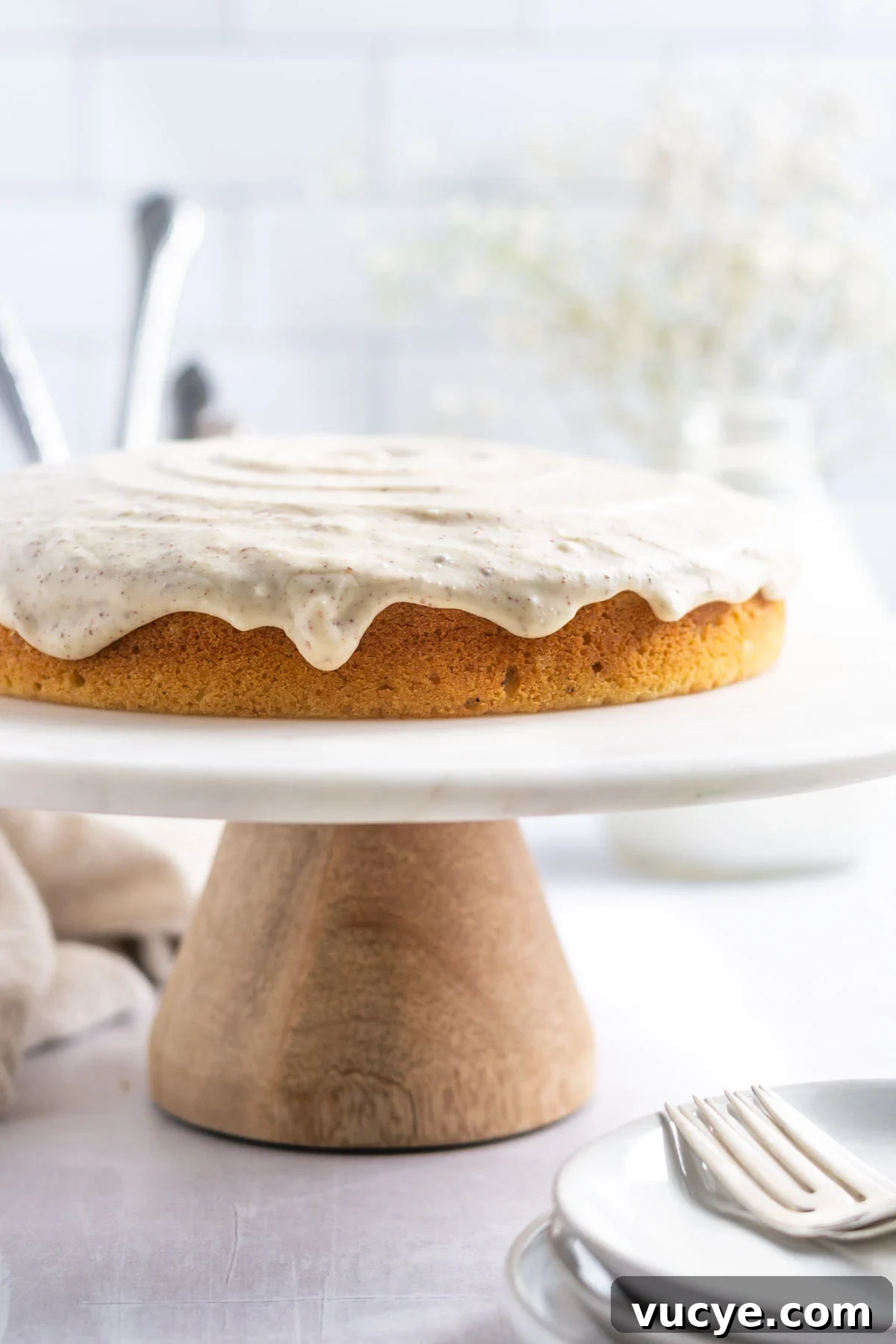 Moist Cardamom Cake Recipe with Warm Spices 3 cardamom cake on a cake stand