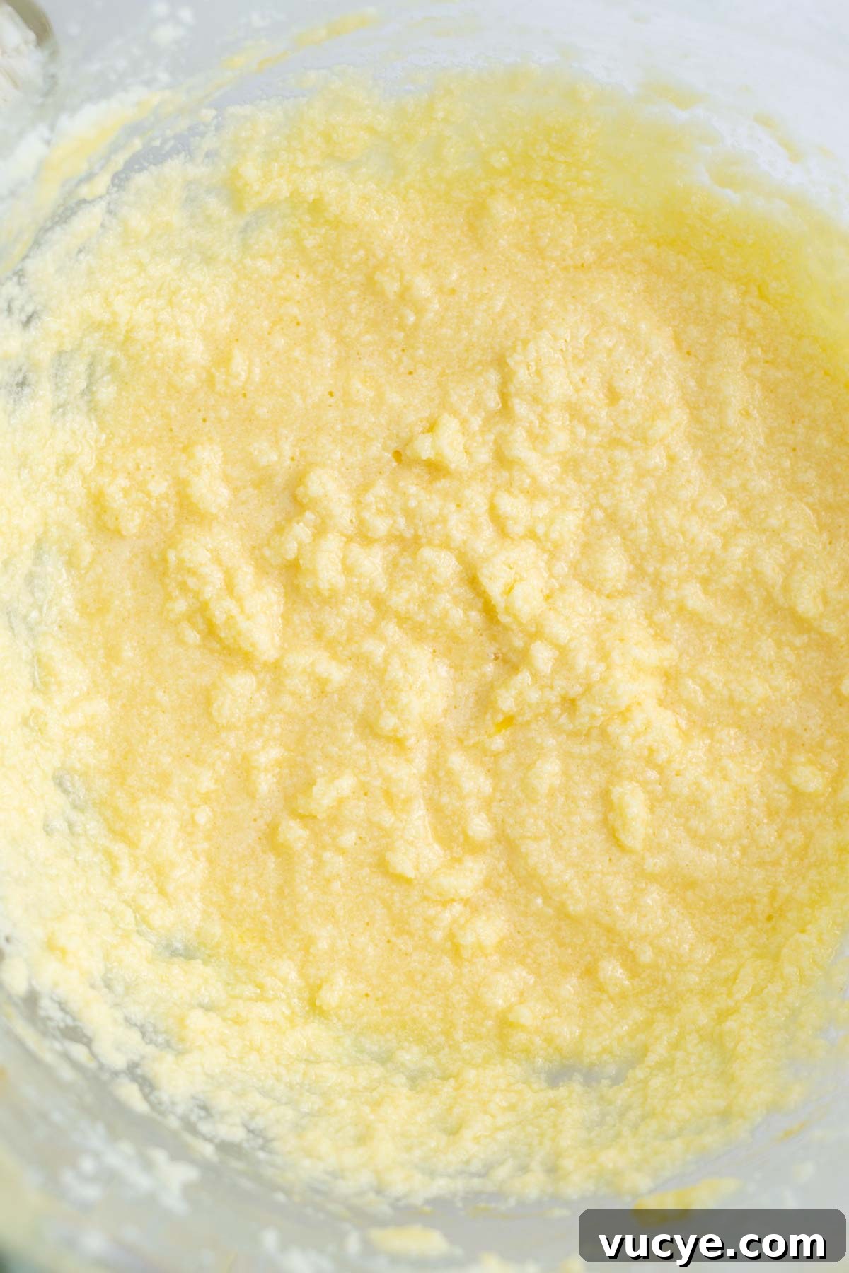 Moist Cardamom Cake Recipe with Warm Spices 8 cardamom cake batter looking curdled after eggs and sour cream added