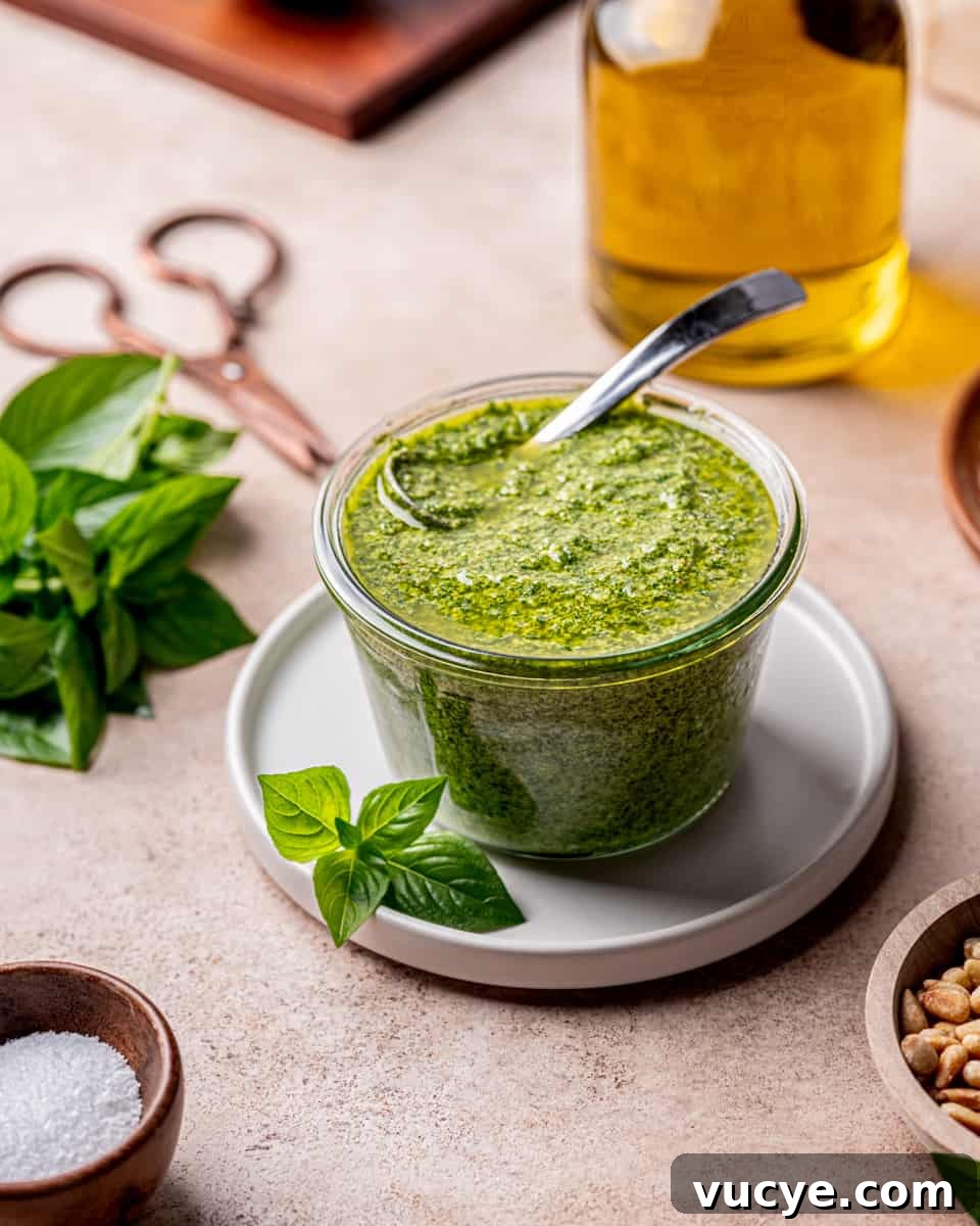 Homemade Basil Pesto: Fast Flavorful Recipe for Any Meal 6 Store Basil Pesto in an airtight jar with a bit of EVOO on top.
