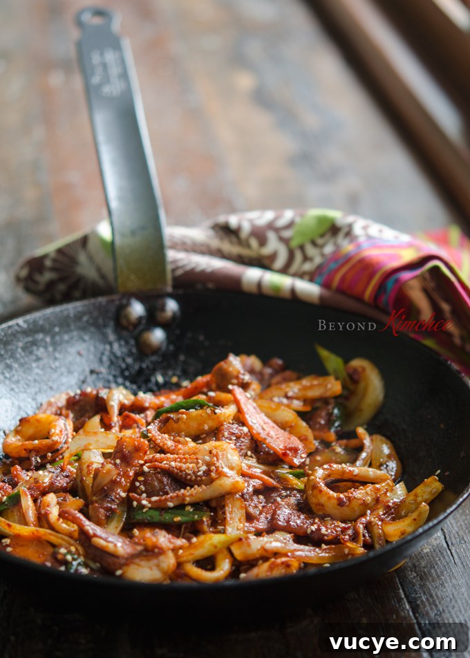 Spicy Pork and Squid Stir-Fry (Osam Bulgogi) Recipe 2 Pork belly and squid stir-fry in a skillet.