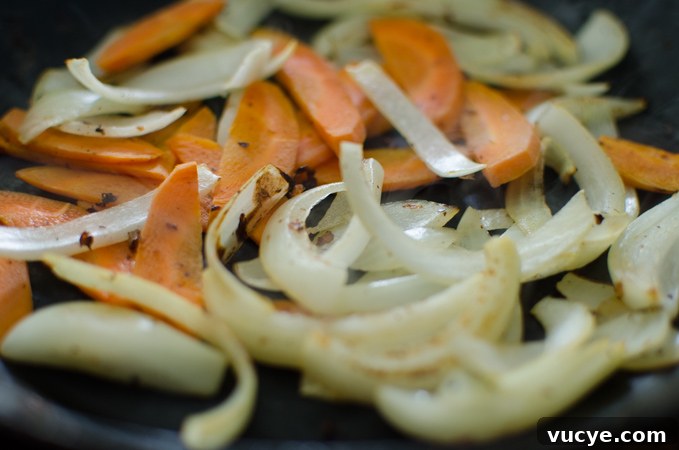 Spicy Pork and Squid Stir-Fry (Osam Bulgogi) Recipe 8 Onion and carrot cooked to soft.