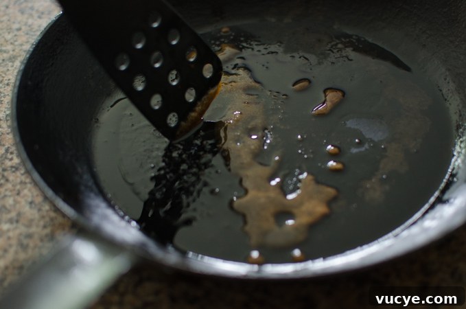Spicy Pork and Squid Stir-Fry (Osam Bulgogi) Recipe 10 A spatula stirring the caramelized sugar.