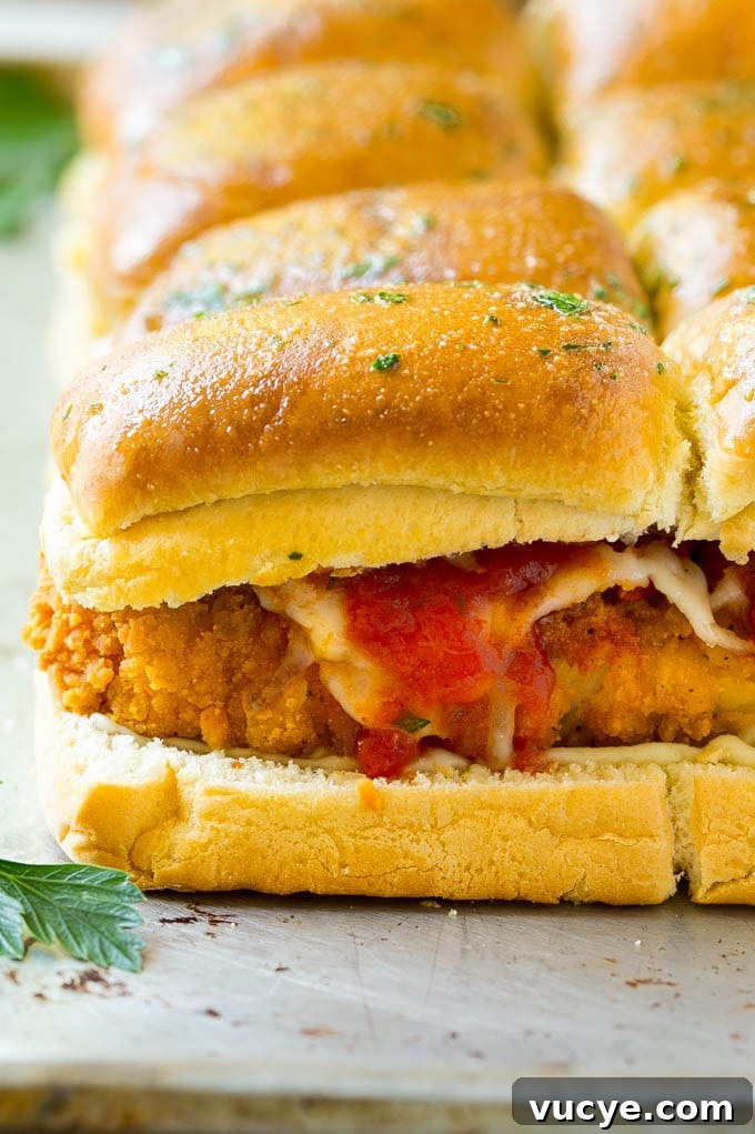 Chicken Parmesan Sliders Crispy chicken with tomato sauce and cheese on slider buns.