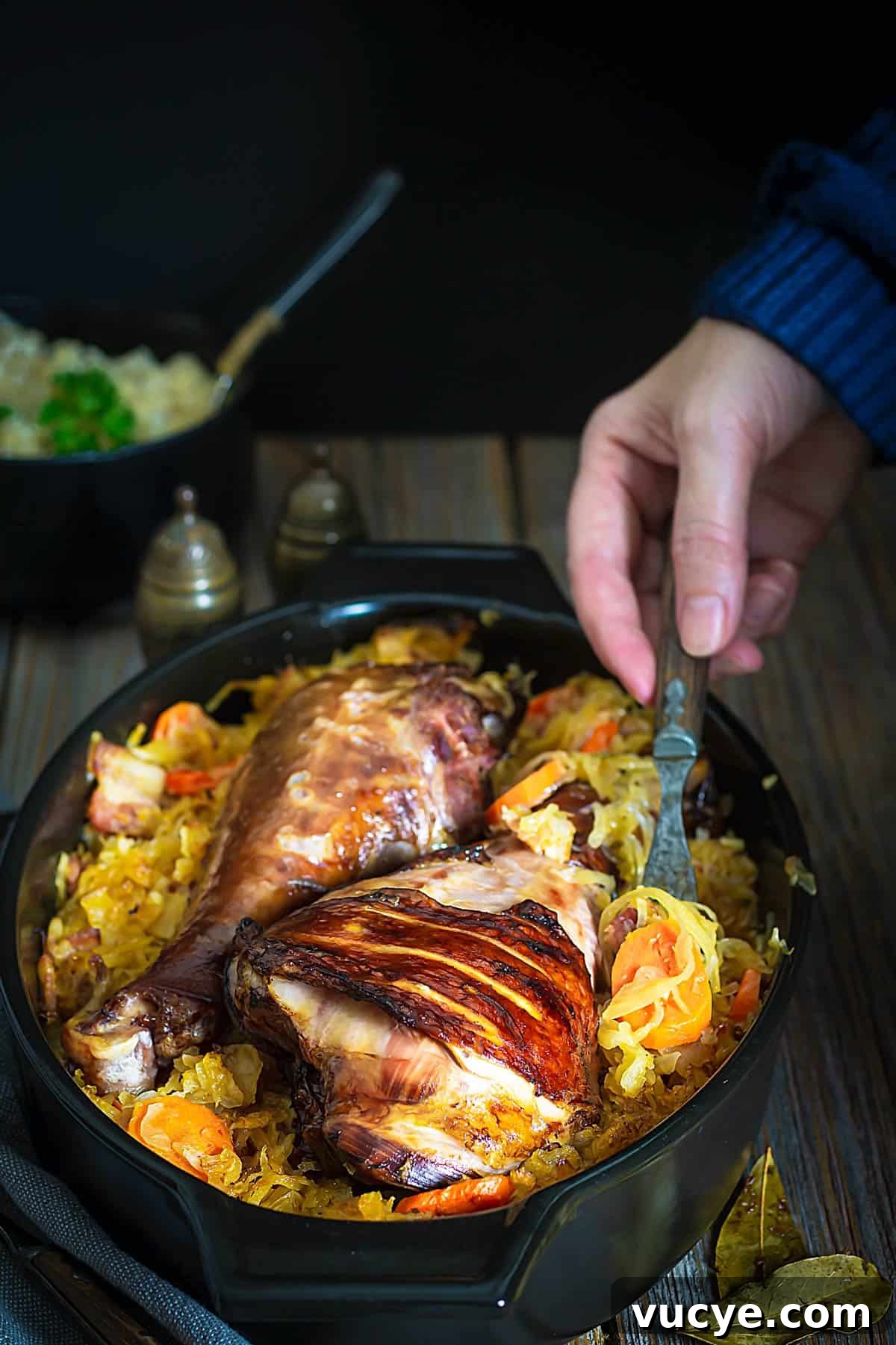 Authentic Serbian Baked Sauerkraut Recipe for Rustic Flavor 5 A person serving sauerkraut dish