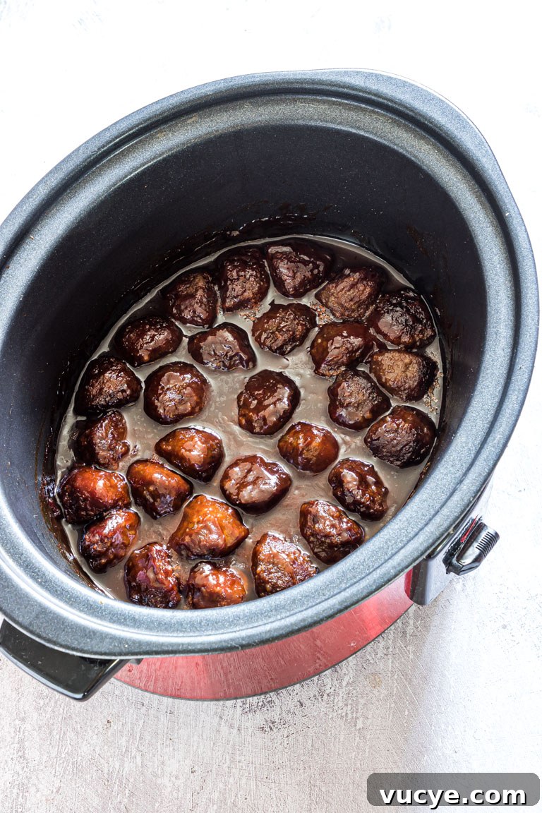 completed slow cooker meatballs inside a crockpot and ready to serve