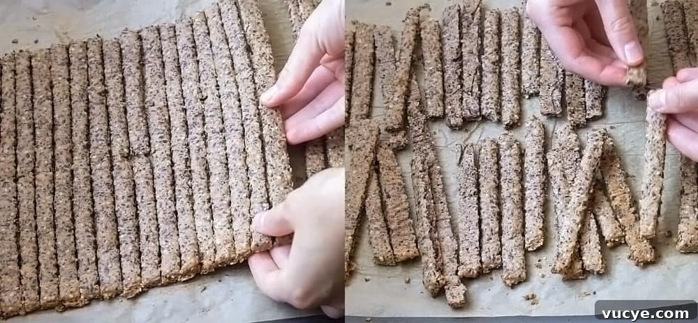 Baked quinoa cracker sticks after baking -  breaking apart the sticks