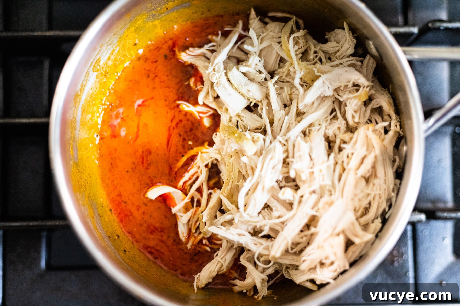 Shredded chicken coated in Buffalo sauce