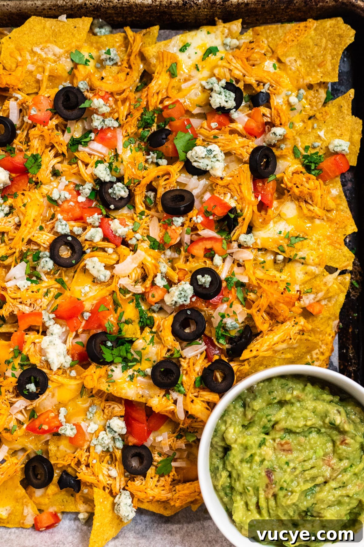 Finished Buffalo chicken nachos with guacamole